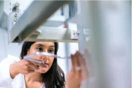 woman fixing an industrial equipment